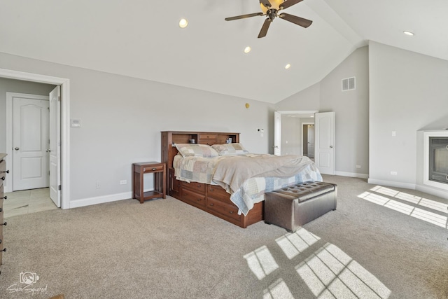 bedroom with light carpet, high vaulted ceiling, visible vents, and baseboards