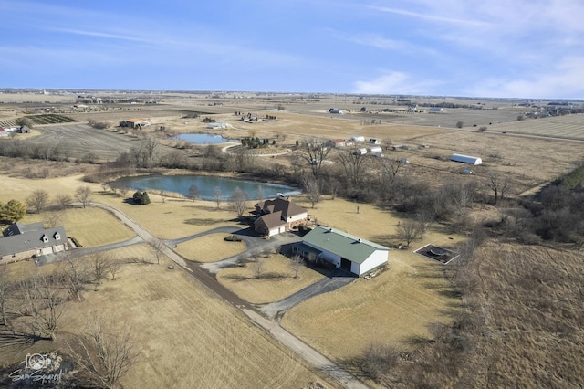 bird's eye view with a rural view and a water view