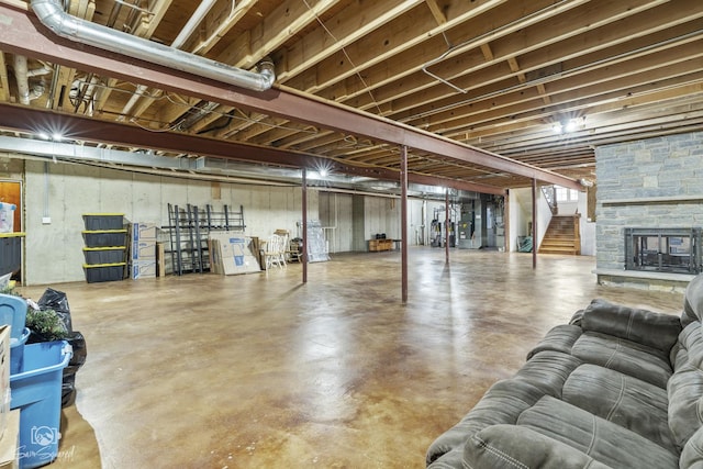 below grade area with a fireplace and stairway