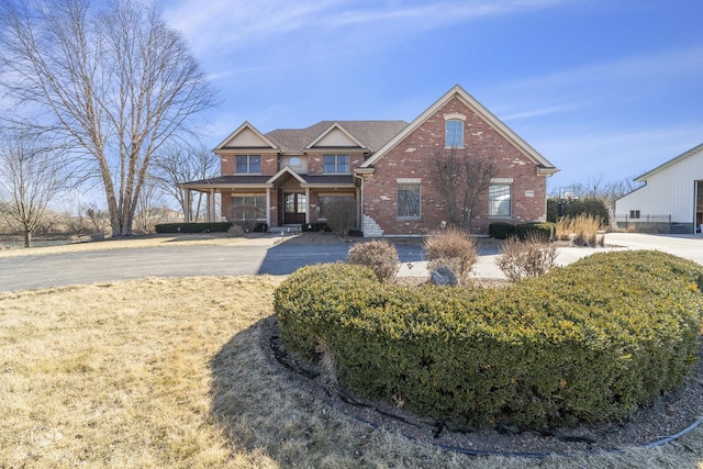 view of front of property featuring brick siding