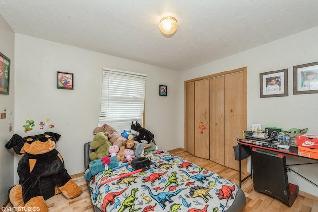 bedroom featuring light hardwood / wood-style flooring and a closet