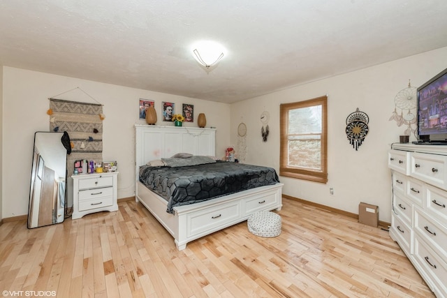 bedroom with light wood-type flooring