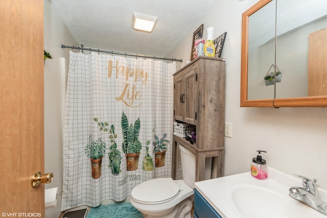 bathroom featuring vanity, toilet, a textured ceiling, and a shower with shower curtain