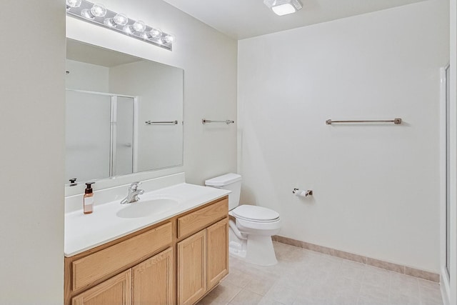 bathroom with vanity, toilet, and an enclosed shower