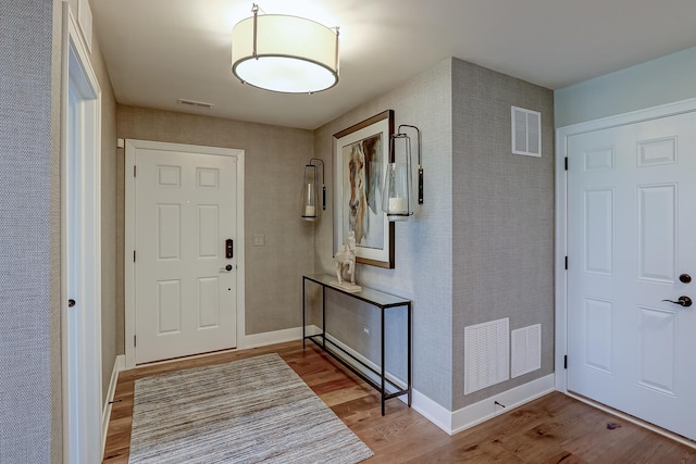 foyer entrance featuring hardwood / wood-style floors