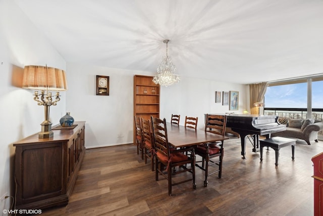 dining room featuring an inviting chandelier, a wall of windows, and dark hardwood / wood-style floors