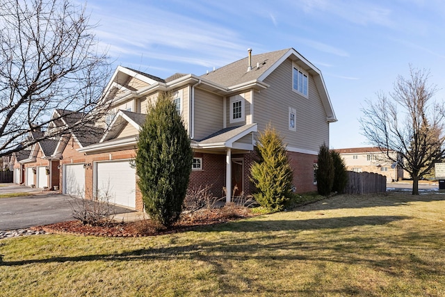 view of front property with a garage and a front lawn