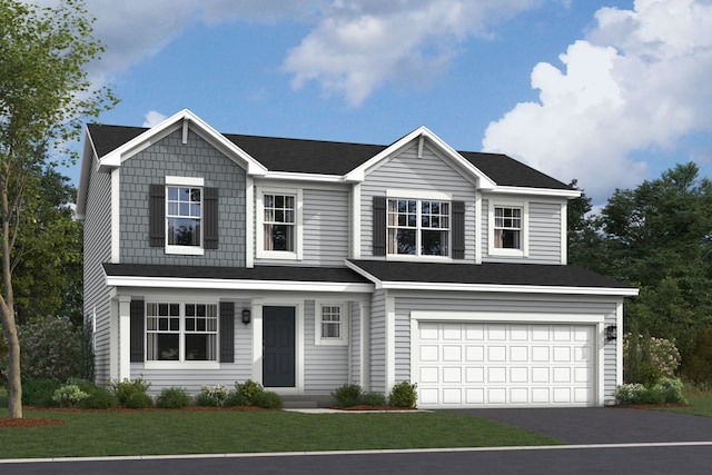 view of front of home featuring a garage and a front lawn