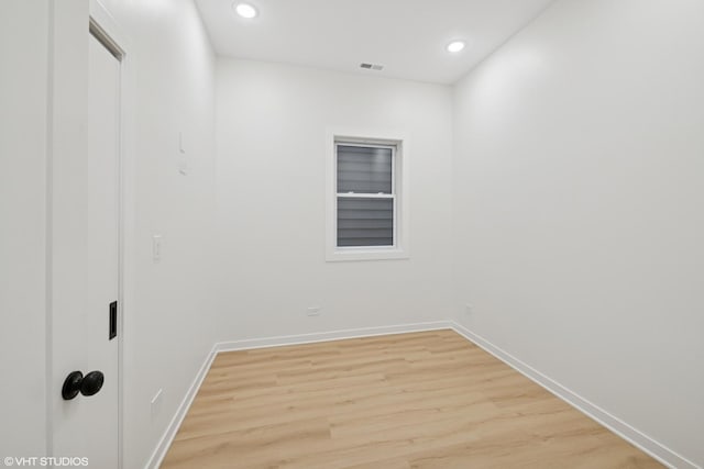 spare room featuring recessed lighting, baseboards, visible vents, and light wood finished floors