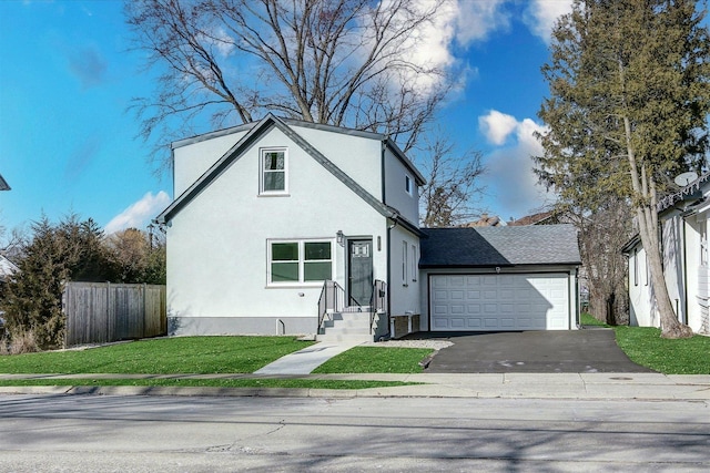 view of front of house featuring a garage and a front yard