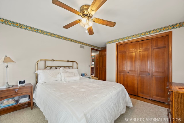 bedroom featuring a closet, visible vents, and ceiling fan