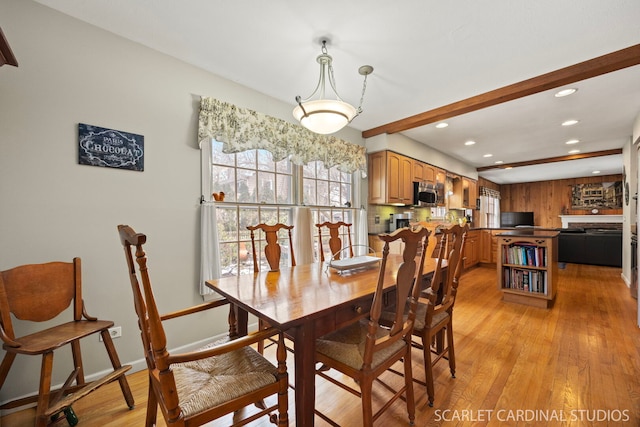 dining area featuring light wood finished floors, beamed ceiling, recessed lighting, and baseboards