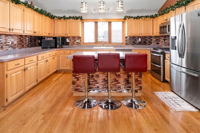 8430 Horizon Ct, Tinley Park, IL 60487 - kitchen with pendant lighting, sink, light hardwood / wood-style flooring, and appliances with stainless steel finishes