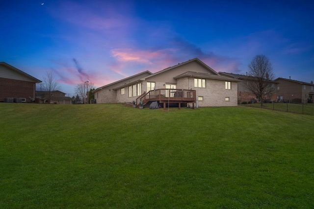 8430 Horizon Ct, Tinley Park, IL 60487 - back house at dusk with a yard and a deck