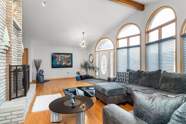 8430 Horizon Ct, Tinley Park, IL 60487 - living room with hardwood / wood-style floors, high vaulted ceiling, a fireplace, beamed ceiling, and a chandelier