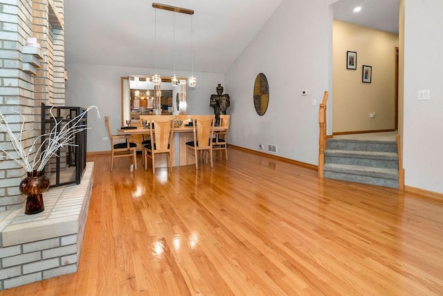 8430 Horizon Ct, Tinley Park, IL 60487 - dining space featuring vaulted ceiling and light hardwood / wood-style floors