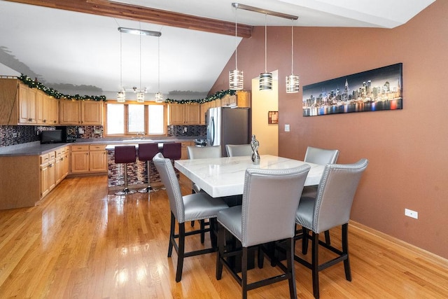 8430 Horizon Ct, Tinley Park, IL 60487 - dining room featuring sink, light hardwood / wood-style flooring, and lofted ceiling with beams