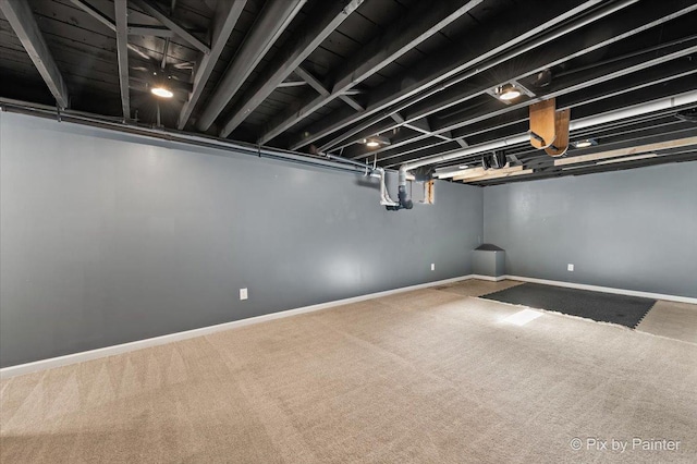 basement with carpet and baseboards