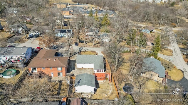 birds eye view of property with a residential view