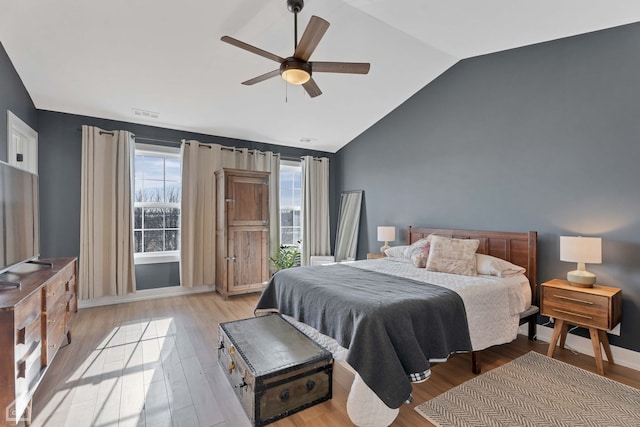 bedroom featuring vaulted ceiling, ceiling fan, and light hardwood / wood-style floors