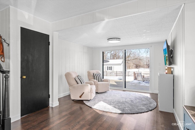 sitting room featuring dark hardwood / wood-style flooring