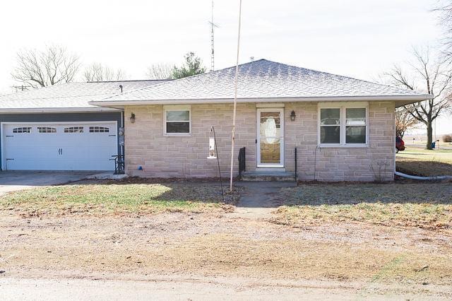 single story home featuring a garage