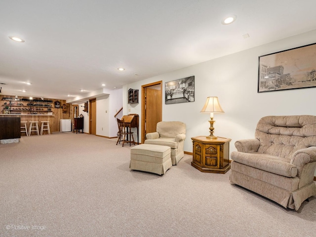 living room with carpet flooring and bar area