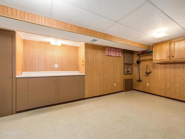 basement with a drop ceiling