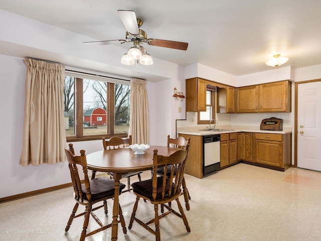 dining area featuring ceiling fan and sink