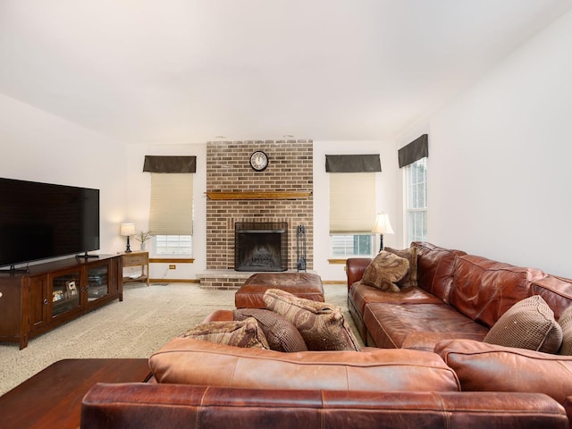 living room featuring a fireplace and carpet flooring