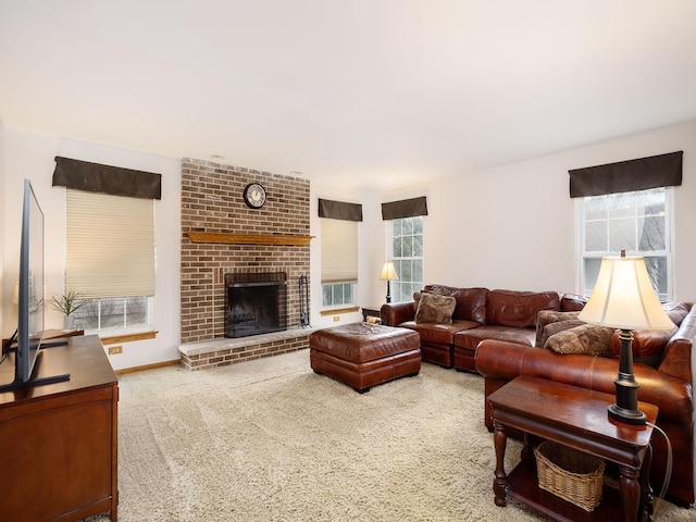 carpeted living room with a brick fireplace