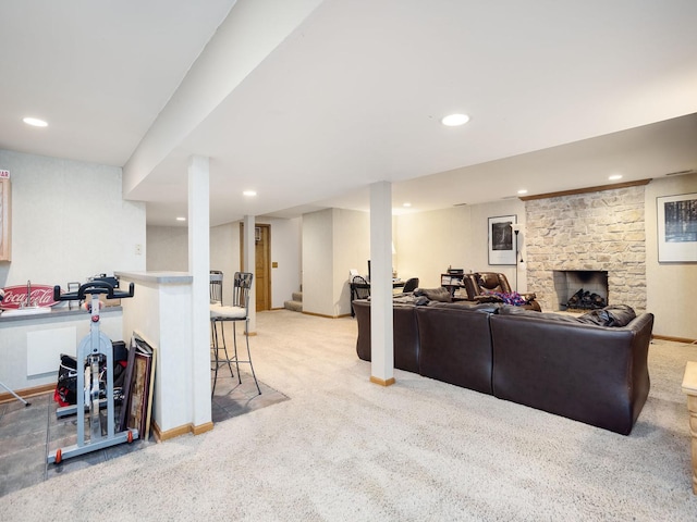 carpeted living room with a fireplace