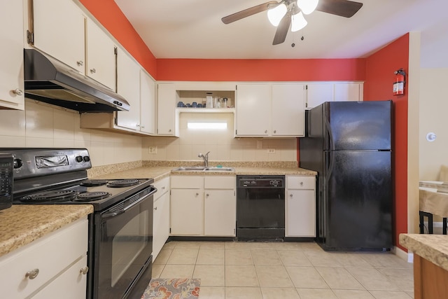 kitchen with sink, white cabinetry, light tile patterned floors, decorative backsplash, and black appliances