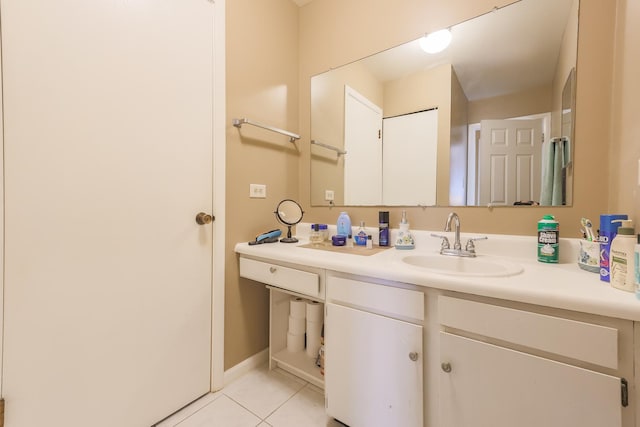 bathroom with tile patterned flooring and vanity