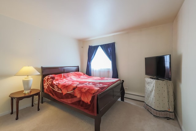 carpeted bedroom with a baseboard radiator