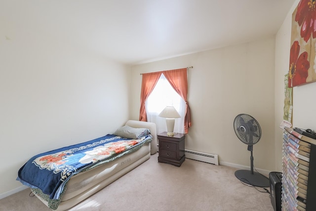 carpeted bedroom with a baseboard radiator