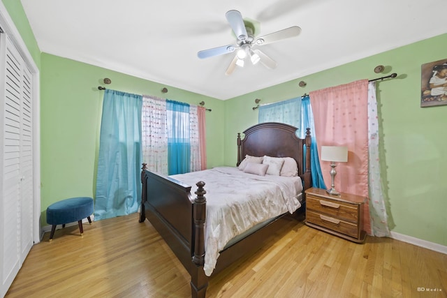 bedroom with ceiling fan and light wood-type flooring