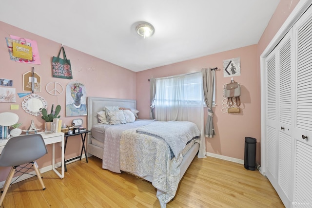 bedroom featuring a closet and light wood-type flooring