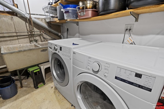 laundry room featuring separate washer and dryer and sink