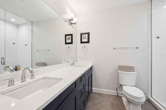 bathroom featuring walk in shower, vanity, and toilet