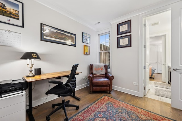 office space featuring crown molding and dark hardwood / wood-style flooring