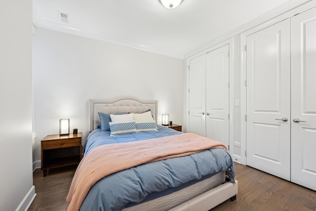 bedroom featuring dark wood-type flooring