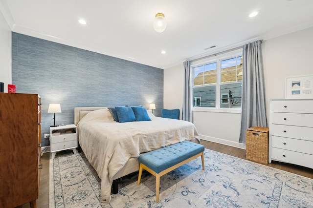 bedroom featuring wood-type flooring and ornamental molding