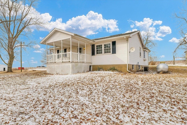 view of front of property featuring central AC and a porch