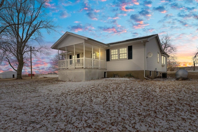 view of front of home featuring central air condition unit and a porch