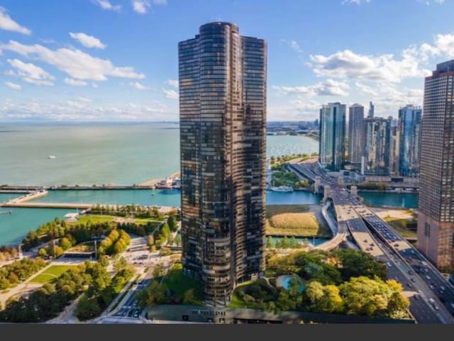 birds eye view of property with a water view