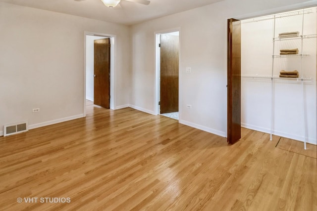 unfurnished bedroom with a closet, ceiling fan, and light wood-type flooring