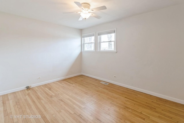 empty room featuring light hardwood / wood-style flooring and ceiling fan