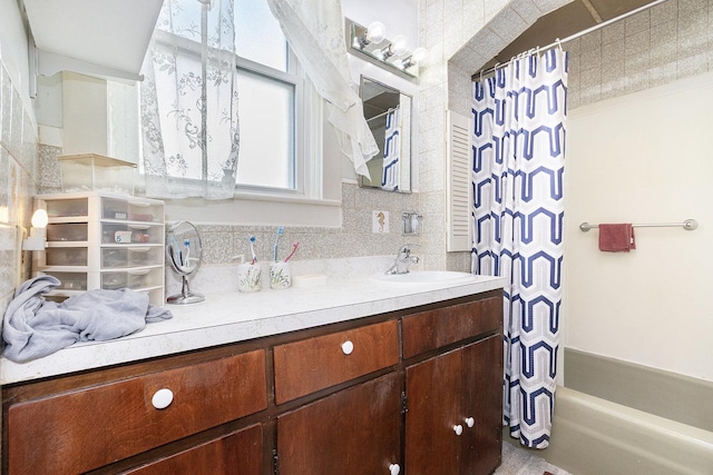 bathroom with backsplash and vanity