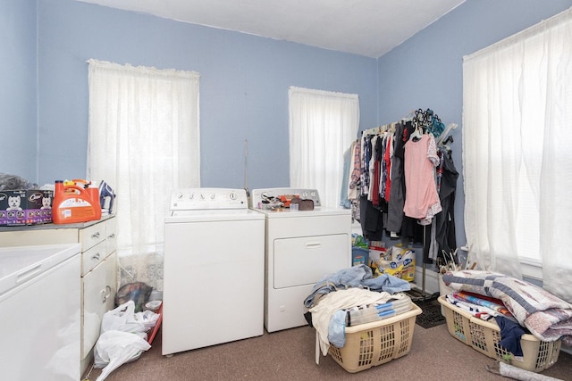 laundry area with a wealth of natural light and separate washer and dryer